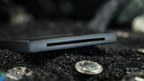 Coin Thru Anything by Nathan Kranzo & TCC Magic - Trick